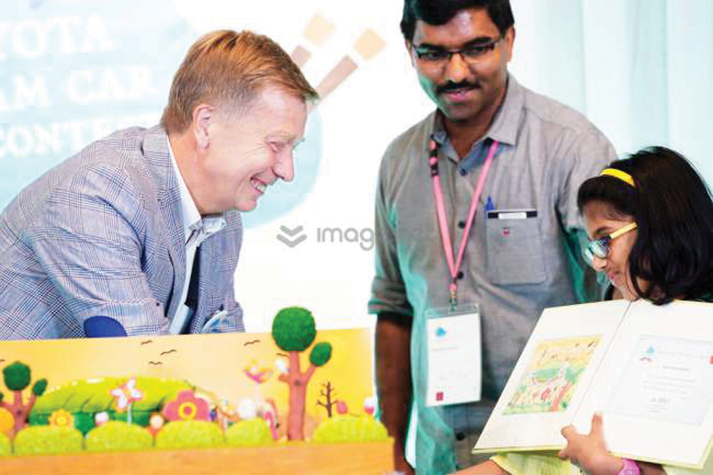 Serah Maria Rejeesh of Qatar, winner of 'Engineering Inspiration Award' for her 'Toyota Go Green Car', receives the award during the 13th Toyota Dream Car Art Contest Award Ceremony in Toyota, Japan.