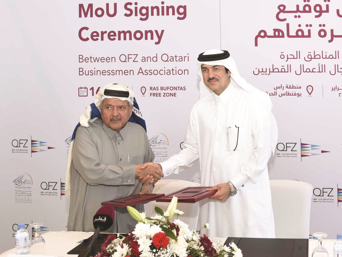 H E Ahmad bin Mohammed Al Sayed (right), Minister of State and Chairman of Qatar Free Zones Authority, and Sheikh Faisal bin Qasim Al Thani,  Chairman of Qatar Businessmen Association (QBA), after signing the MoU at the Business Innovation Complex in Ras 