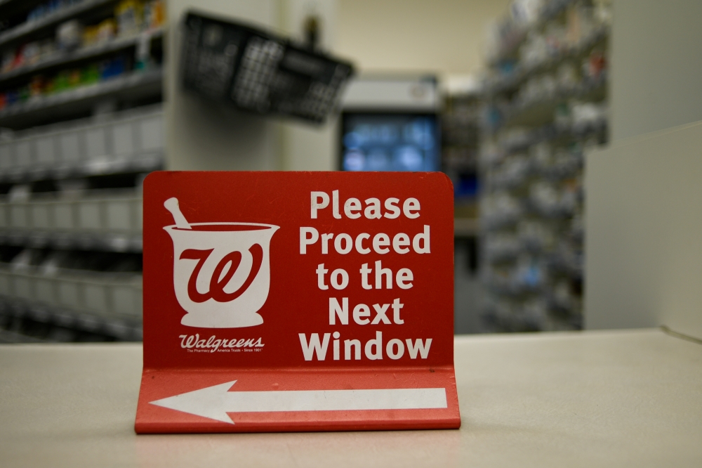 A sign rests on a counter at a Walgreens pharmacy store in Austin, TX, US, March 26, 2018.  Reuters/Mohammad Khursheed
 