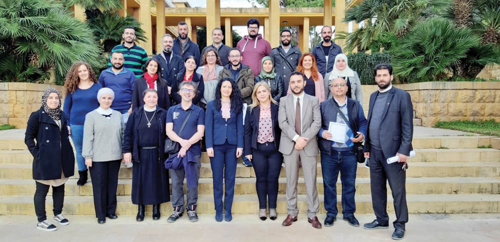 Participants of the training programme pose for a group photo.