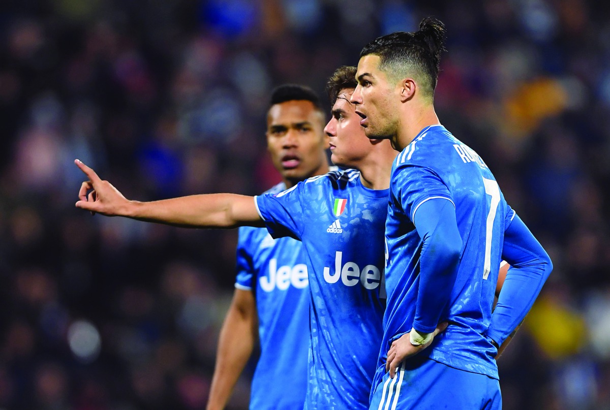 Juventus' Paulo Dybala with Cristiano Ronaldo,  SPAL v Juventus, Paolo Mazza, Ferrara, Italy - February 22, 2020. Reuters/Alberto Lingria