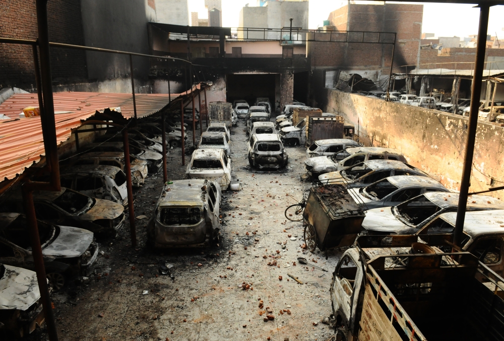 A car work shop in Shiv Vihar area of North East Delhi which was set on fire by rioters, February 26, 2020. (Imtiyaz Khan / Anadolu Agency)
 