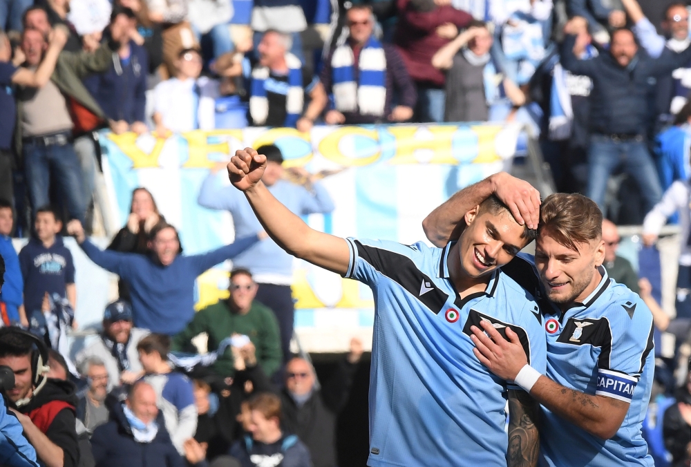 Lazio's Joaquin Correa celebrates scoring their second goal with teammate Ciro Immobile REUTERS/Alberto Lingria