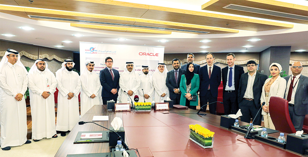 Kahramaa President, Eng. Essa bin Hilal Al Kuwari, and David de Mayo, First Vice-President of Oracle, with other officials during the agreement signing ceremony.  