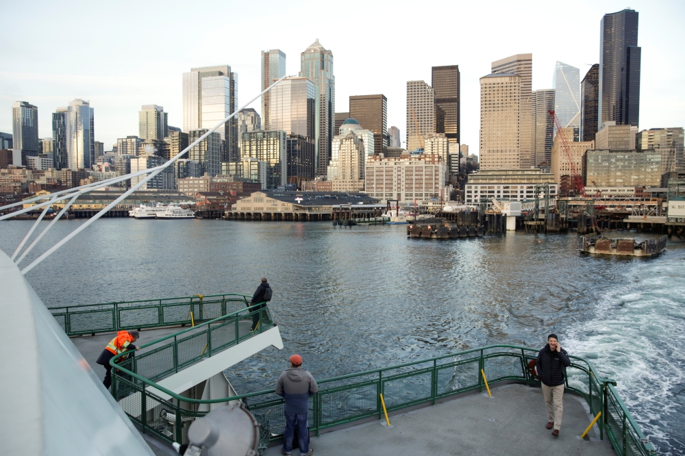 Passengers on a Washington State Ferry after officials released a statement asking riders driving aboard to consider staying in their vehicles and taking other steps to minimize coronavirus exposure in Seattle, Washington, US. March 4, 2020. Reuters/Jason