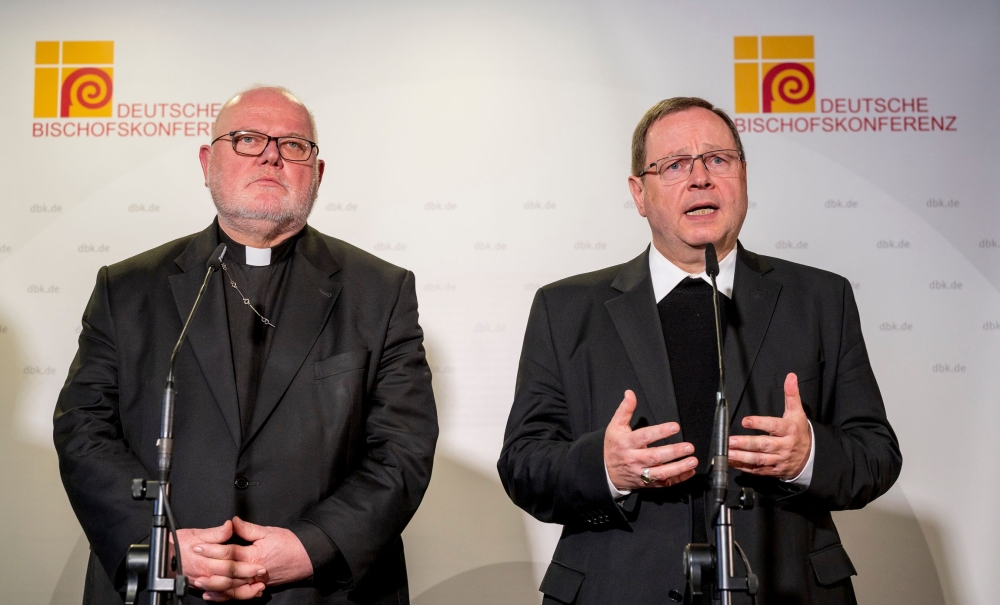 German Cardinal Reinhard Marx (L) and Limburg's Bishop Georg Baetzing, who was elected Marx' successor as leader of the German Bishops' Conference, address a press conference on March 3, 2020 during an episcopal gathering in Mainz, western Germany. AFP / 