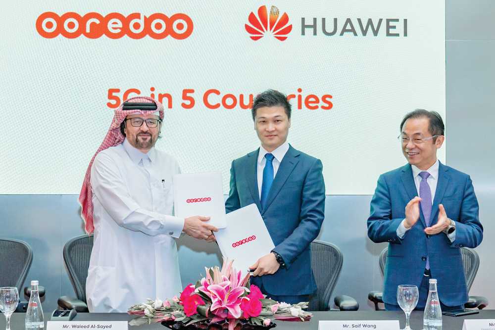 Waleed Al Sayed, Deputy Group CEO of Ooredoo, and Saif Wang, President of Key Account Ooredoo at Huawei, during the partnership signing ceremony.  
