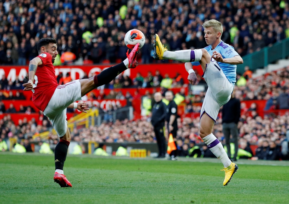 Manchester United's Bruno Fernandes in action with Manchester City's Oleksandr Zinchenko Reuters/Phil Noble