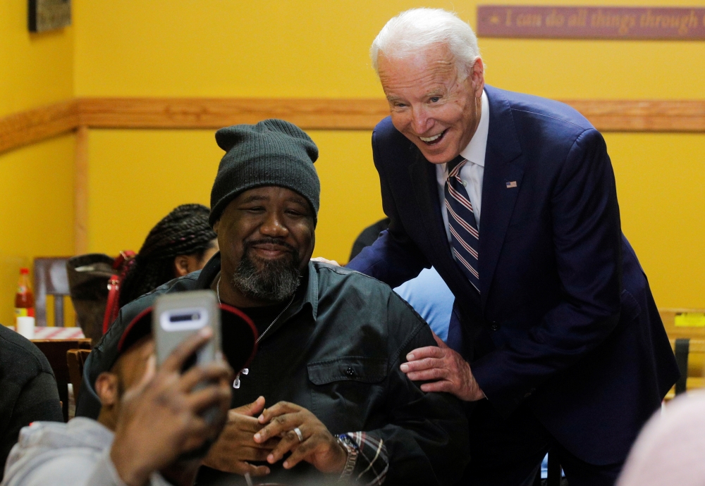 Democratic US presidential candidate and former Vice President Joe Biden greets supporters at Pearls Southern Cooking in Jackson, Mississippi, March 8, 2020. Reuters/Brendan McDermid
 