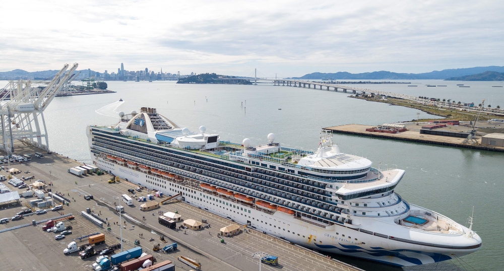Tents begin to appear as workers tend to passengers disembarkingf from the Grand Princess cruise ship at the Port of Oakland in California on March 09, 2020. The cruise ship carrying thousands of people who were stranded for days due to a coronavirus outb