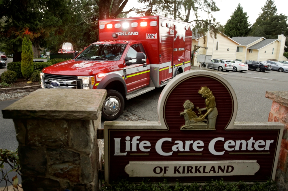 An ambulance arrives at the Life Care Center of Kirkland, the Seattle-area nursing home at the epicenter of one of the biggest coronavirus outbreaks in the United States, in Kirkland, Washington, U.S. March 10, 2020. REUTERS/Jason Redmond
 