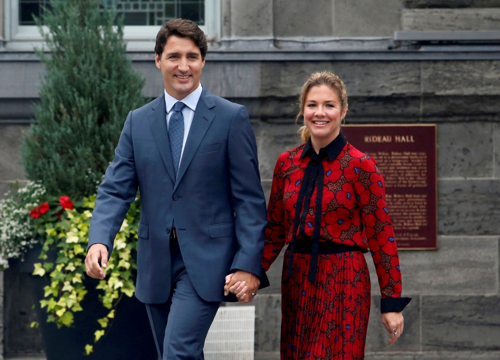  FILE PHOTO: Canada's Prime Minister Justin Trudeau and his wife Sophie Gregoire Trudeau leave Rideau Hall after asking Governor General Julie Payette to dissolve Parliament, and mark the start of a federal election campaign in Canada, in Ottawa, Ontario,