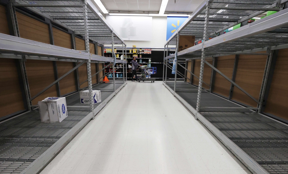 As the coronavirus continues to spread across the United States, stores like Walmart had problems keeping up with the high demand for paper goods leading to empty shelves on March 14, 2020 in Uniondale, New York.  Al Bello/Getty Images/AFP