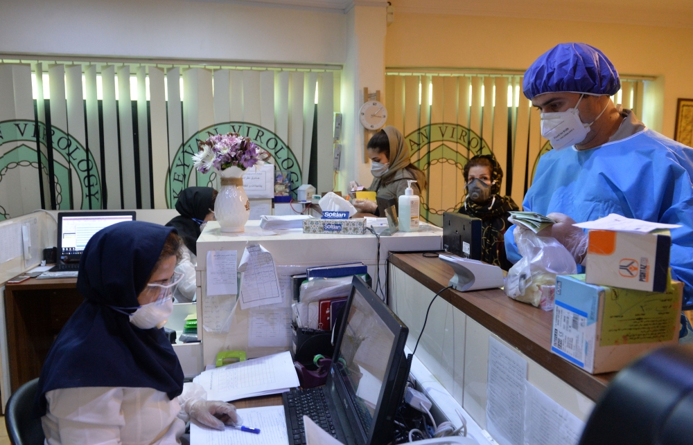 TEHRAN, IRAN - MARCH 10: Medical staffs work at Keyvan Virology Laboratory to confirm the coronavirus cases in Tehran, Iran on March 10, 2020. The death toll from the coronavirus outbreak in Iran rose to 291, local media reported on Tuesday. ( Fatemeh Bah
