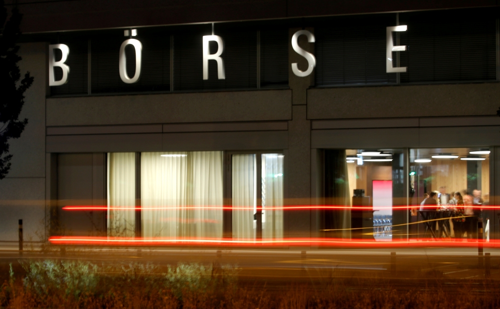A long exposure shows traffic flowing past the illuminated word 