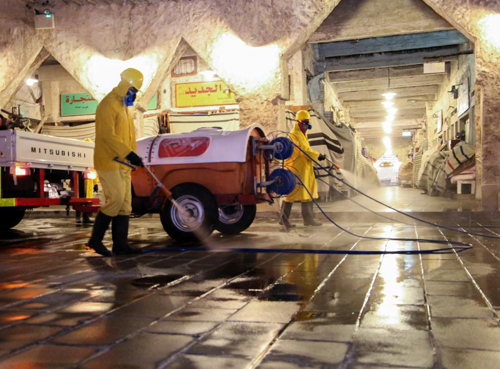 Workers disinfecting Souq Waqif area. 
