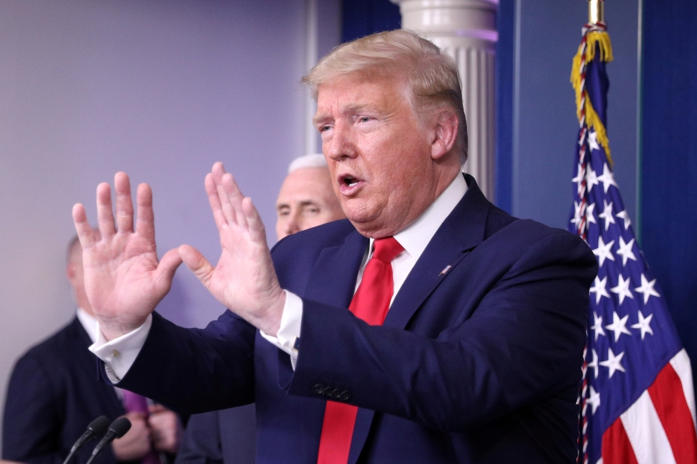 FILE PHOTO: U.S. President Donald Trump addresses the daily coronavirus task force briefing at the White House in Washington, U.S., April 3, 2020. REUTERS/Tom Brenner/File Photo