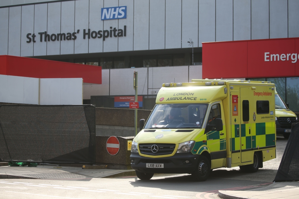 An ambulance leaves St Thomas' Hospital in central London on April 7, 2020, where Britain's Prime Minister Boris Johnson is in intensive care with symptoms of the novel coronavirus COVID-19.  / AFP / Isabel Infantes