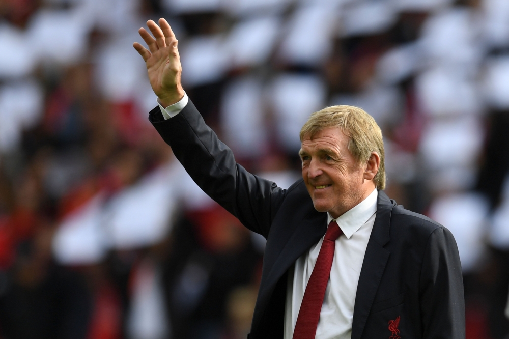  In this file photo Former Liverpool player and manager Kenny Dalglish takes the applause of the supporters a day after having the new grandstand named after him, on the pitch ahead of the English Premier League football match between Liverpool and Manche