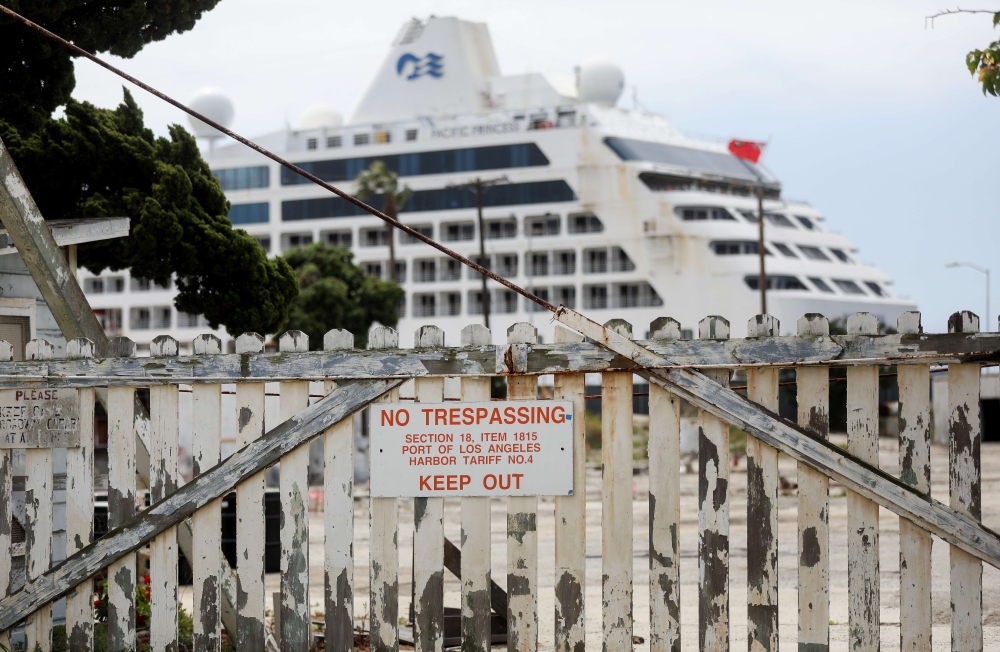 :SAN PEDRO, CALIFORNIA - APRIL 20: The Pacific Princess cruise ship is shown docked at the Port of Los Angeles after arriving earlier in the day on April 20, 2020 in San Pedro, California. The ship was one of the last three remaining cruise ships still sa