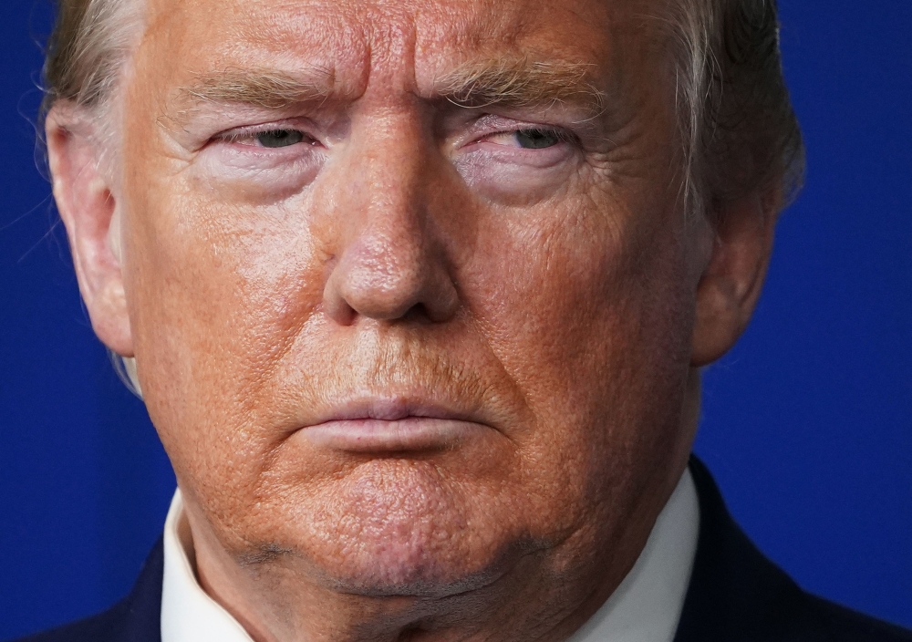 US President Donald Trump looks on during the daily briefing on the novel coronavirus, which causes COVID-19, in the Brady Briefing Room of the White House in Washington, DC on April 21, 2020. / AFP / MANDEL NGAN