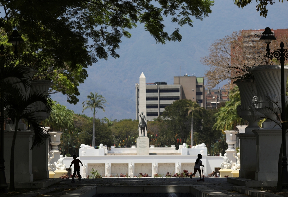 Children play at a park during an 8 hour permission for children under 14 years old to go outside, as the nation wide quarantine continues due to the coronavirus disease (COVID-19) outbreak, in Caracas, Venezuela April 26, 2020. REUTERS/Manaure Quintero