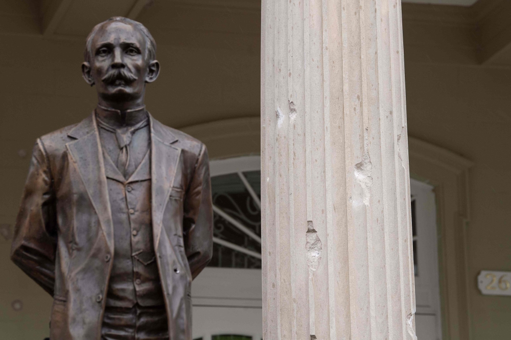 Bullet impacts are seen on a column in front of the Cuban embassy in Washington, DC, on April 30, 2020, after a man fired at the building. A man was arrested early Thursday after opening fire on the Cuban embassy, the US Secret Service said. The unidentif