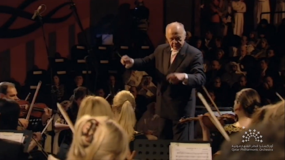 Screenshot of Lorin Maazel conducting the Qatar Philharmonic Orchestra in a video of their inaugural performance of Beethoven’s Symphony No. 5 now accessible via QPO’s social media  channels.