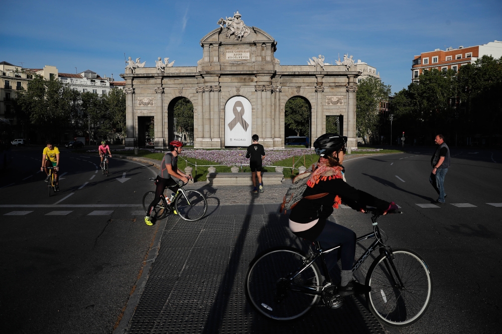 MADRID, SPAIN - MAY 2: People ride bicycles as the government allowed people to exercise within 1 km around of their house starting today in Madrid, Spain on May 2, 2020. The death toll from coronavirus (Covid-19) outbreak has reached 25,100 so far, incre