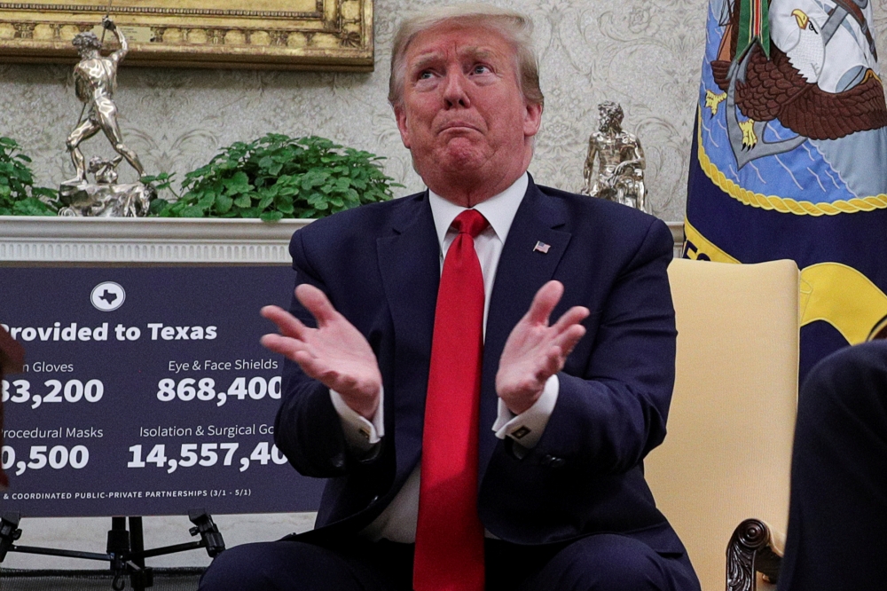 U.S. President Donald Trump speaks during a meeting about the coronavirus disease (COVID-19) response with Texas Governor Greg Abbott in the Oval Office at the White House in Washington, U.S., May 7, 2020. REUTERS/Tom Brenner TPX IMAGES OF THE DAY
