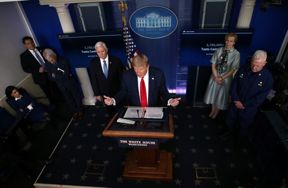 U.S. President Donald Trump answers questions at the daily coronavirus disease (COVID-19) task force briefing flanked by Dr. Anthony Fauci, Vice President Mike Pence, Dr. Deborah Birx and Admiral Brett Giroir at the White House in Washington, U.S., April 