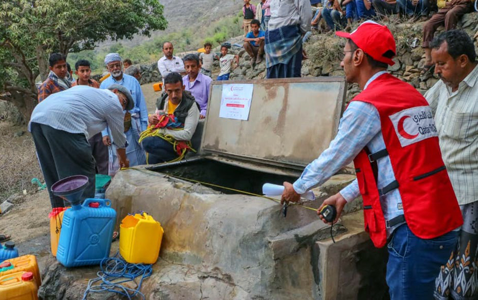 QRCS officials rehabilitating a water well in Yemen.