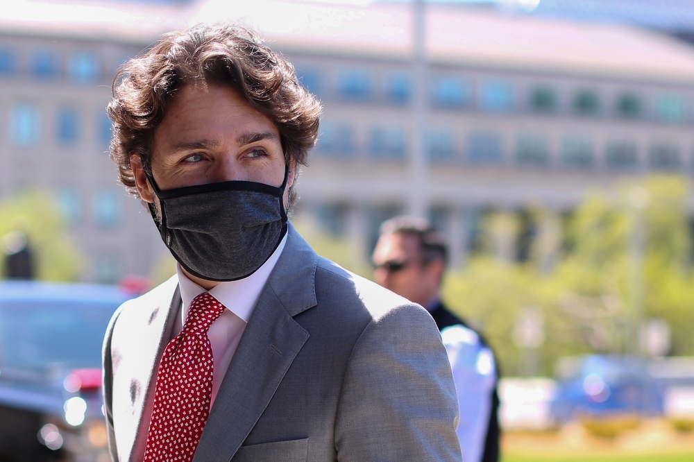 (FILES) In this file photo Canadian Prime Minister Justin Trudeau arrives on Parliament Hill to attend a sitting of the Special Committee on the COVID-19 Pandemic, May 20, 2020 in Ottawa, Canada. / AFP / Dave Chan
