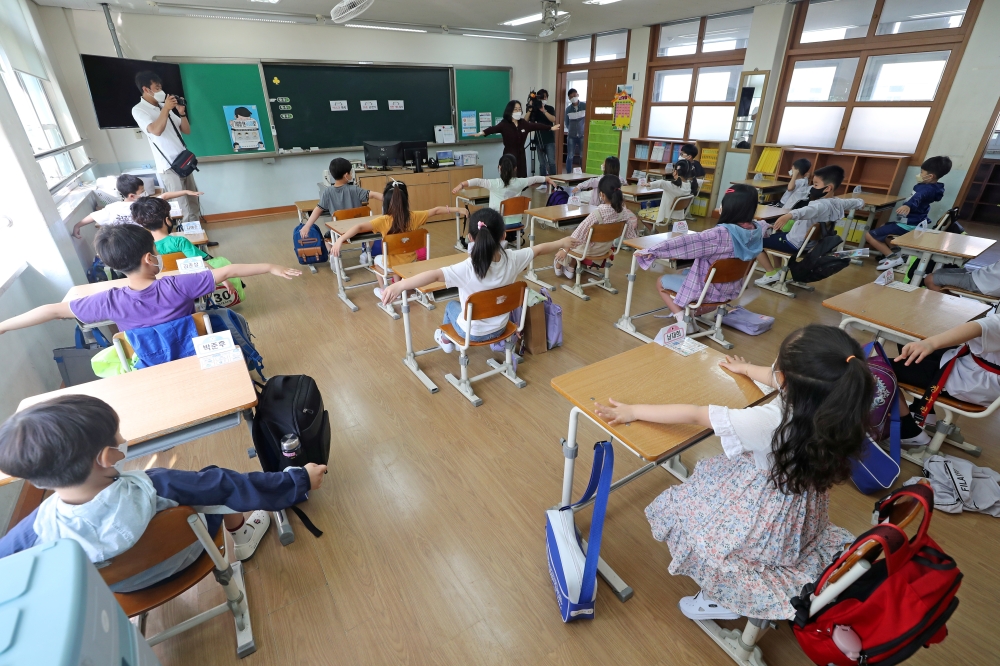 Students practice social distancing amid the coronavirus disease (COVID-19) outbreak at an elementary school in Daejeon, South Korea, May 27, 2020. Yonhap via REUTERS