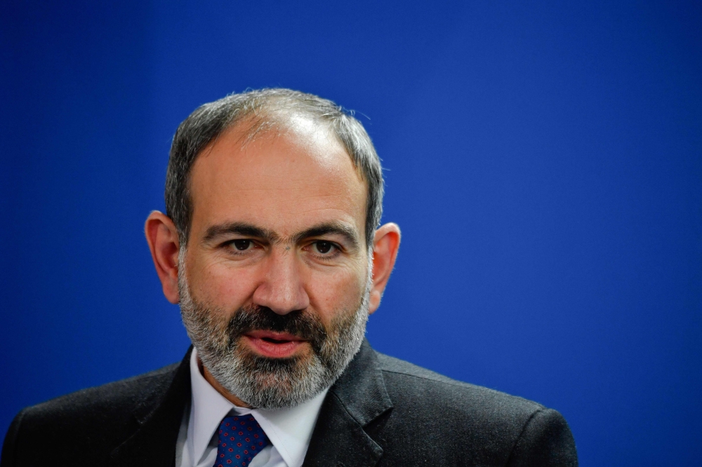 (FILES) In this file photo taken on February 1, 2019 Armenian Prime Minister Nikol Pashinyan holds a joint press conference with the German chancellor after a meeting at the chancellery in Berlin.  / AFP / John MACDOUGALL