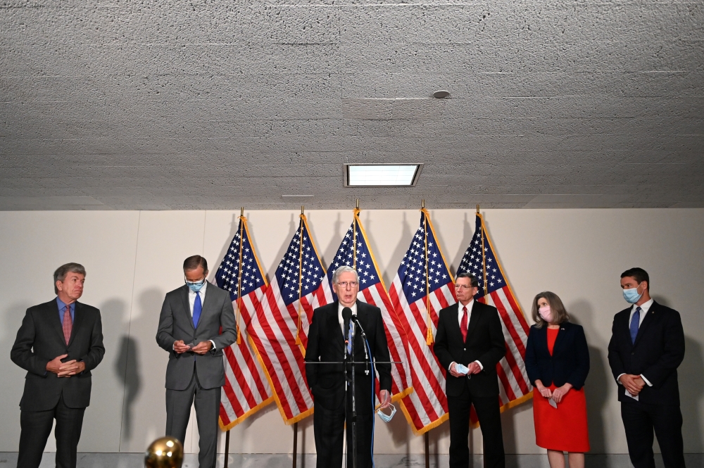 US Senate Majority Leader Mitch McConnell (R-KY) and other Republicans speak to reporters on Capitol Hill in Washington, U.S., June 2, 2020. REUTERS/Erin Scott