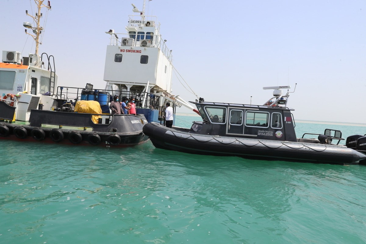 Officials from the Ministry of Transport and Communications during a COVID-19-related safety inspection and awareness drive at a maritime entry point. 