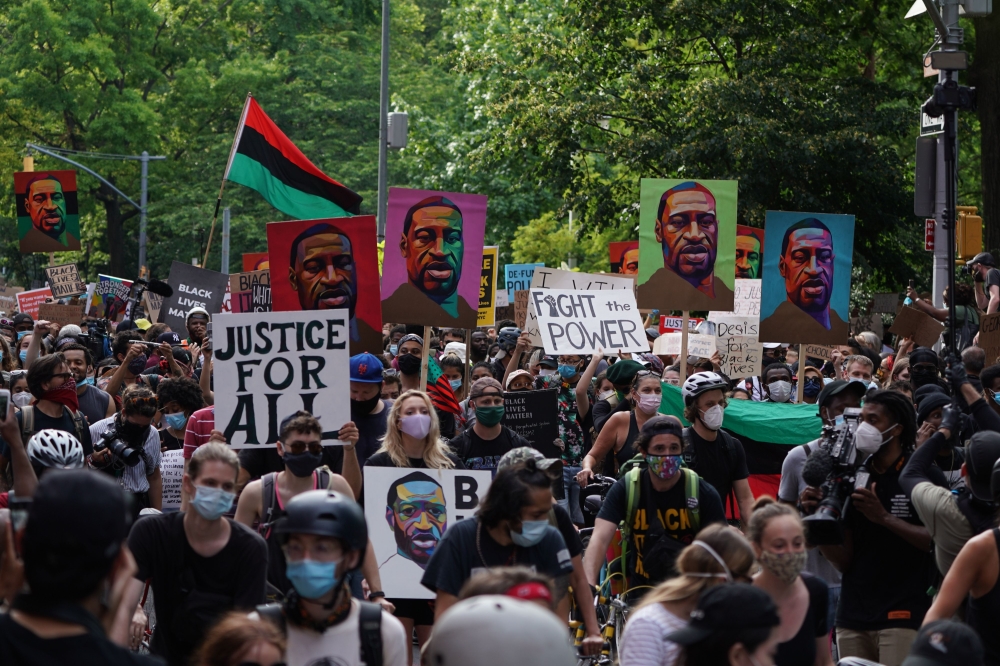 TOPSHOT - Protesters hold 