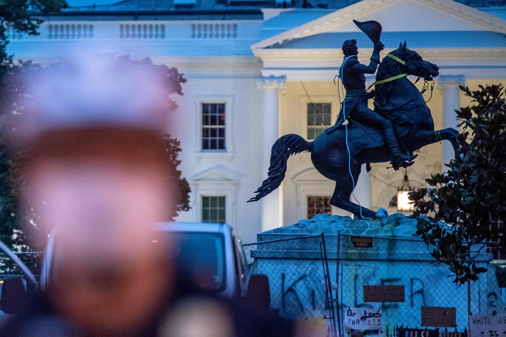 The equestrian statue of former US President General Andrew Jackson has ropes and chains still hanging, after protesters tried to topple it, at Lafayette square, in front of the White House, in Washington, DC on June 22, 2020. AFP / Eric BARADAT