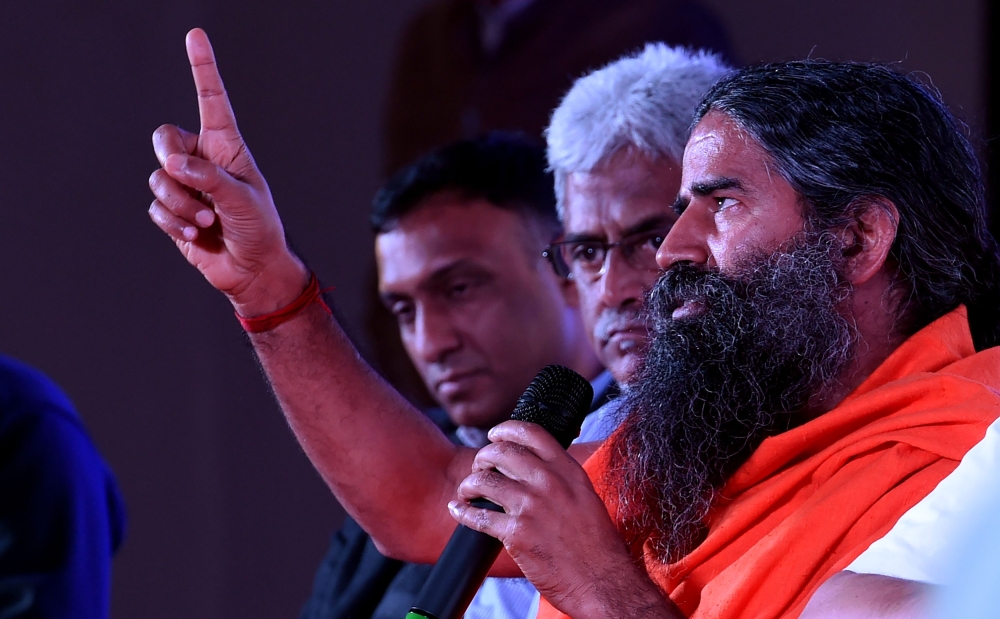 (FILES) Indian yoga guru Baba Ramdev. India's best known guru announced on June 23 the launch by his Ayurvedic consumer goods corporation of two herbal remedies to 