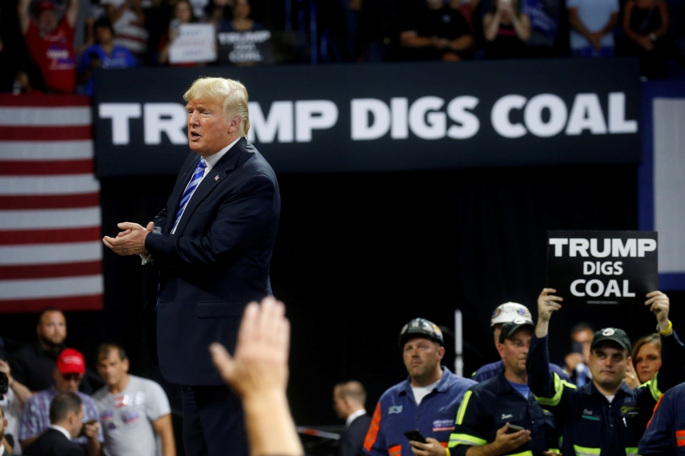 FILE PHOTO: U.S. President Donald Trump acknowledges coal miners during a Make America Great Again rally at the Civic Center in Charleston, West Virginia, U.S., August 21, 2018. REUTERS/Leah Millis