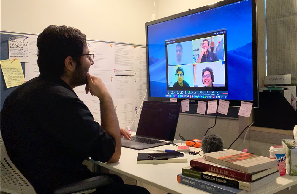 NU-Q student Adan Ali, a co-founder of Mask Banao, meets with his teammates.
