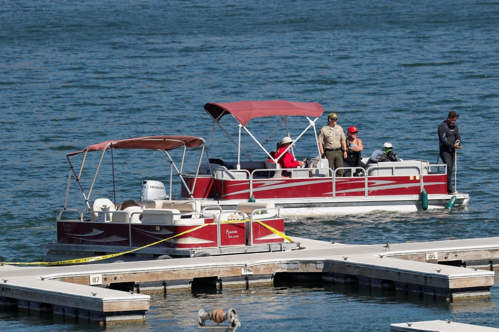 The boat that actor Naya Rivera was using when she went missing is seen with yellow tape as search operations continue on Lake Piru in California, U.S., July 9, 2020. REUTERS/Mario Anzuoni

