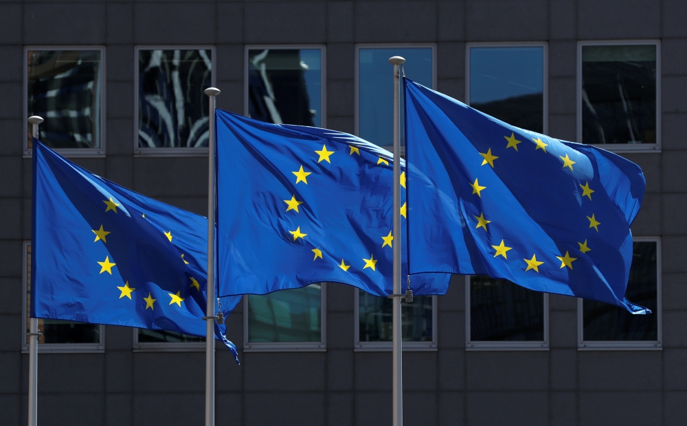 FILE PHOTO: European Union flags flutter outside the European Commission headquarters in Brussels, Belgium June 25, 2020. REUTERS/Yves Herman/File Photo