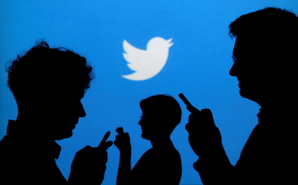FILE PHOTO: The Twitter logo is displayed on a screen on the floor of the New York Stock Exchange (NYSE) in New York City, U.S., September 28, 2016. REUTERS/Brendan McDermid
