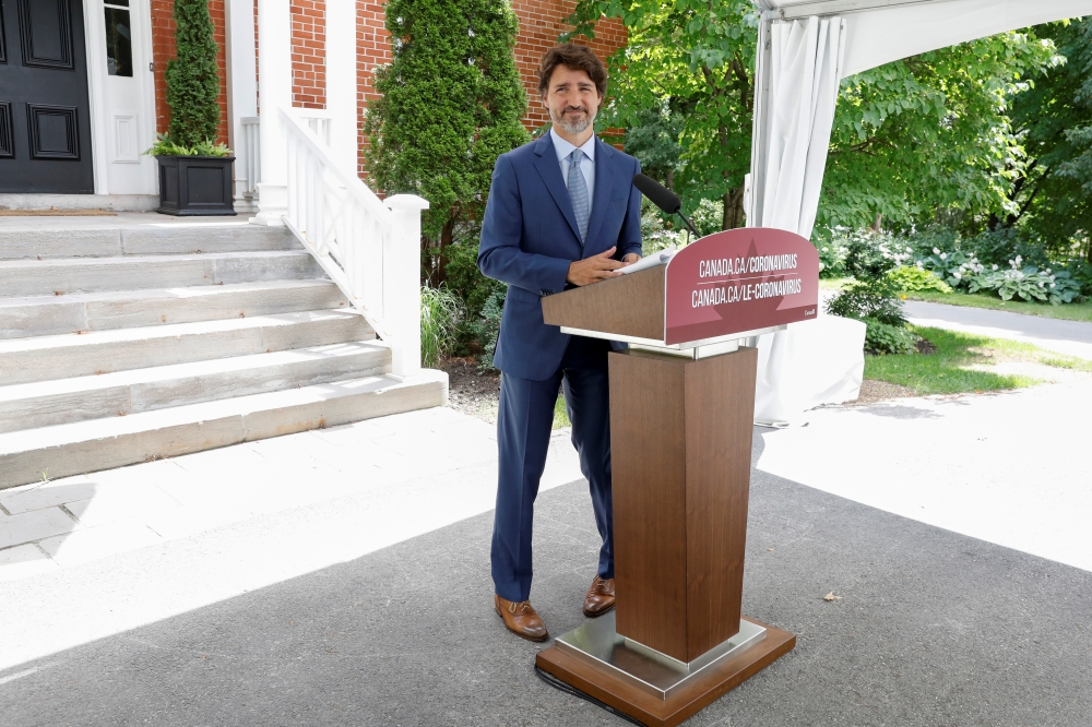Canada's Prime Minister Justin Trudeau leaves a news conference at Rideau Cottage, as efforts continue to help slow the spread of the coronavirus disease (COVID-19), in Ottawa, Ontario, Canada July 13, 2020. REUTERS/Blair Gable
