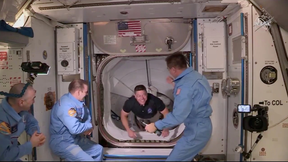 FILE PHOTO: NASA astronaut Bob Behnken arrives at the International Space Station aboard SpaceX's Crew Dragon capsule in this still image taken from video May 31, 2020. NASA/Handout via REUTERS
