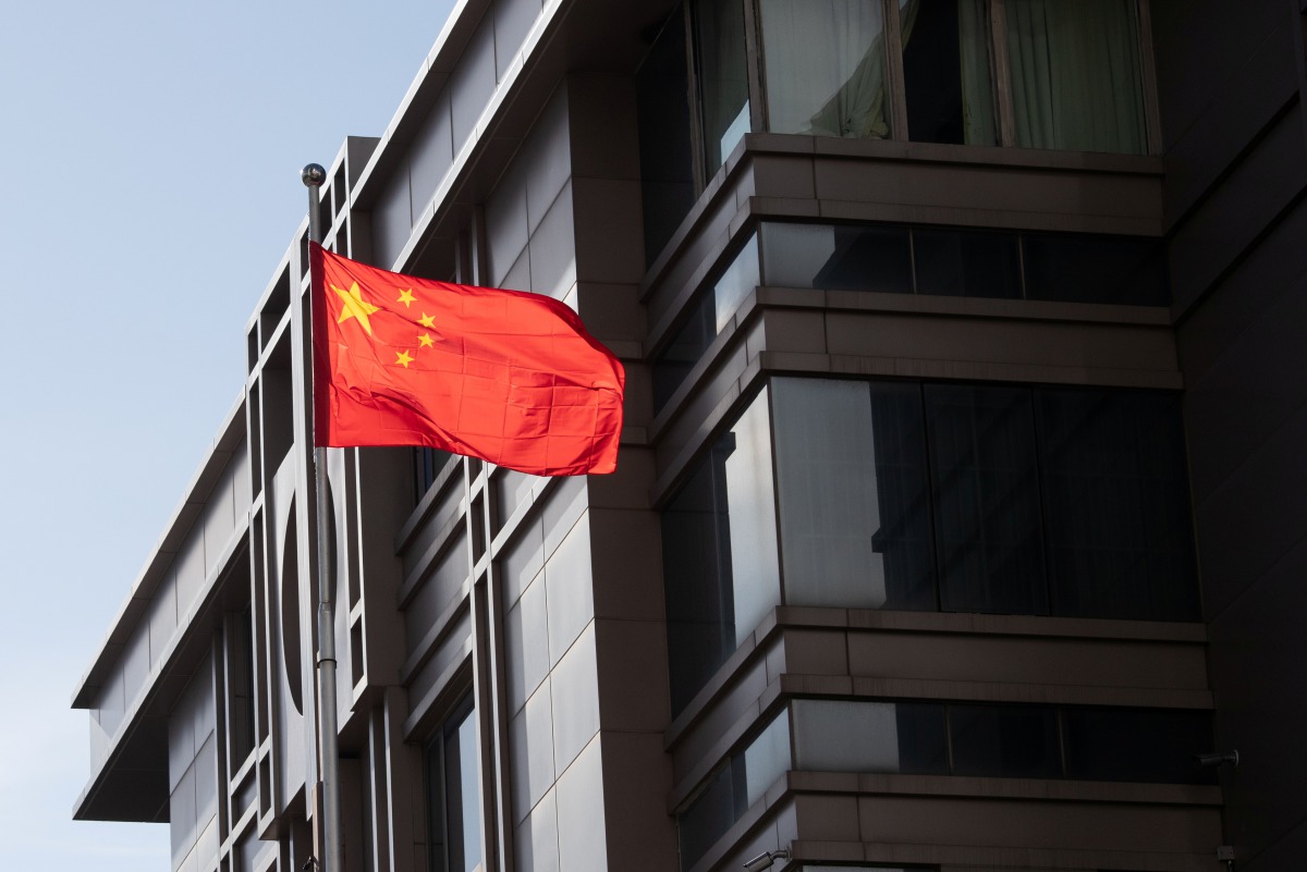 China’s national flag is seen waving at the China Consulate General in Houston, Texas, U.S., July 22, 2020. REUTERS/Adrees Latif
