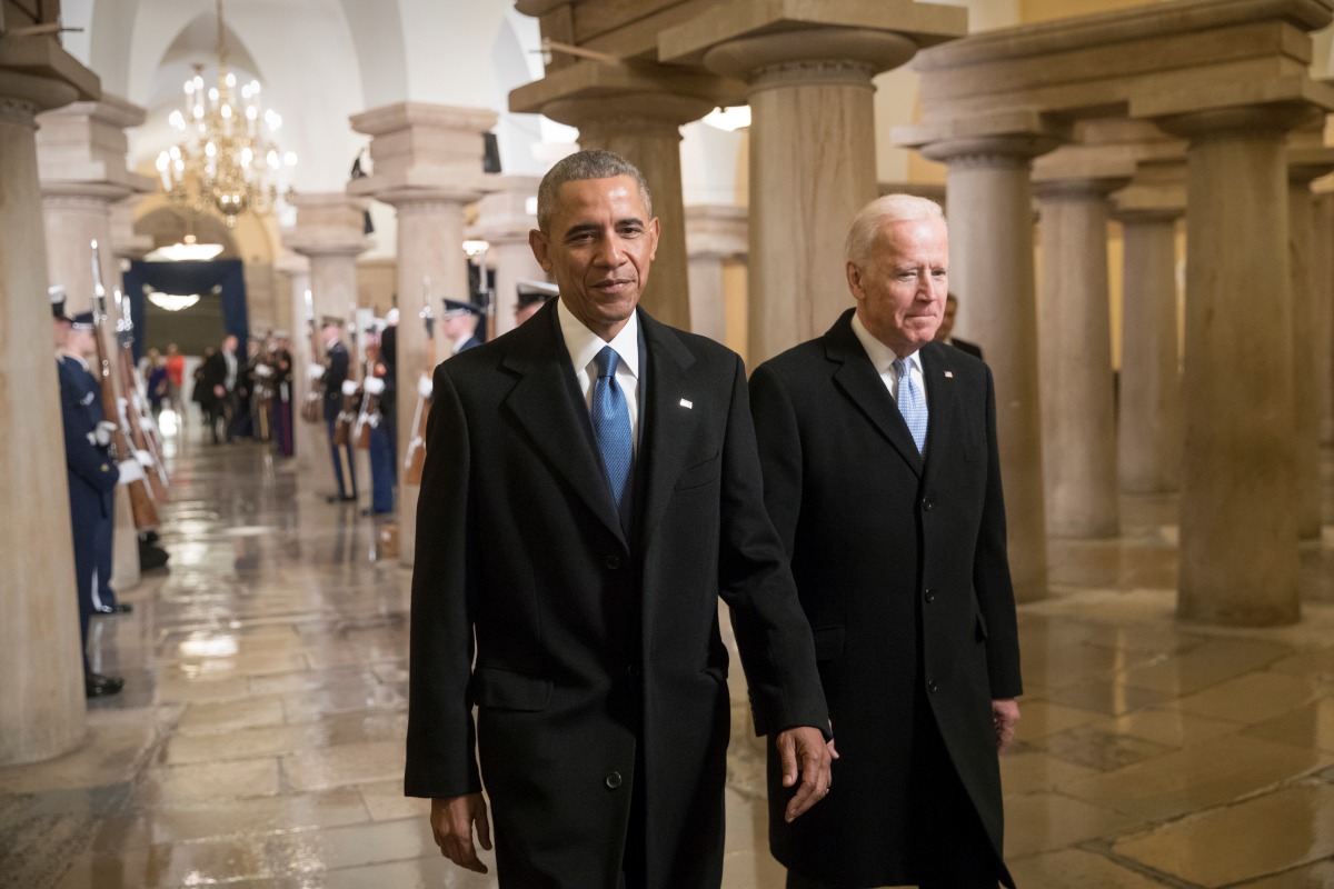 FILE PHOTO: President Barack Obama and Vice President Joe Biden walk through the Crypt of the Capitol for Donald Trump?s inauguration ceremony, in Washington, Friday, Jan. 20, 2017. REUTERS/J. Scott Applewhite/Pool/File Photo
