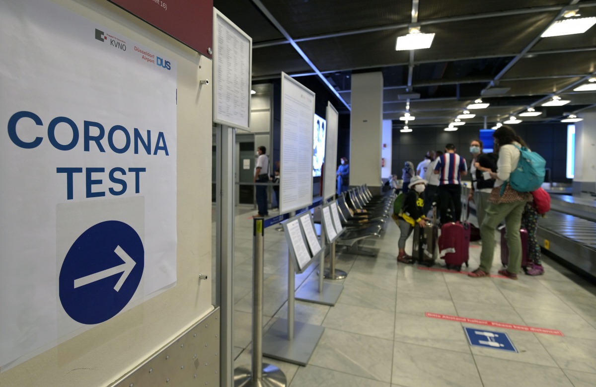 A sign 'corona test' is seen at a corona screening station in the medical center of the airport in Duesseldorf, western Germany, on July 27, 2020, amid the new coronavirus COVID-19 pandemic. / AFP / Ina FASSBENDER
